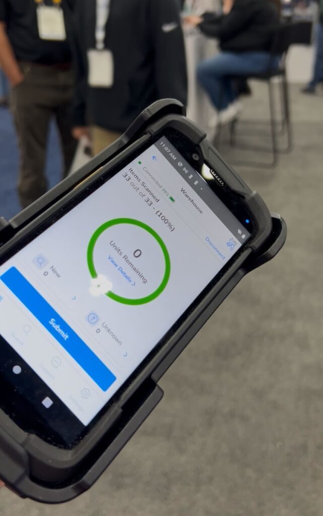 Xemelgo’s director of growth, Garrett Gross, showcases the collaboration with Zebra Technologies by holding an RFID handheld scanner capable of fast, accurate tracking of products.