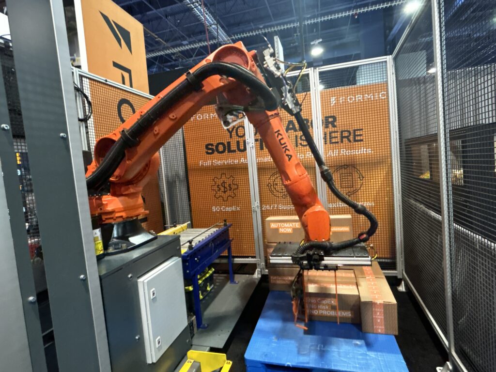 Formic’s booth at Pack Expo Las Vegas featured a Kuka robot palletizing boxes. The company helps manufacturers adopt robotic automation with support and maintenance by providing equipment, service, and technology. Photo taken at the Las Vegas Convention Center on September 29, 2025.
