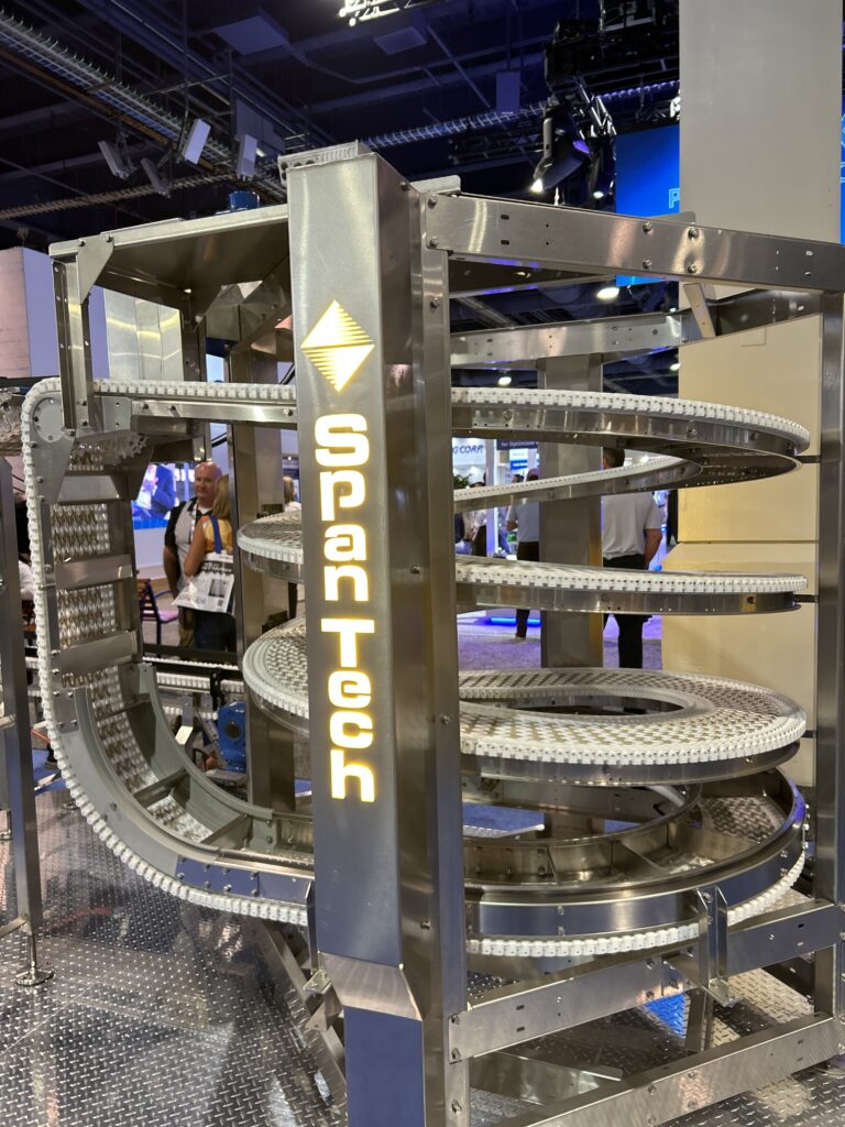 Spantech displayed a variety of material handling solutions at Pack Expo Las Vegas, including a spiral conveyor designed out of stainless steel with a plastic chain for washdown applications.