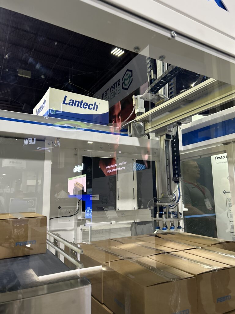 The CODI Flex Stack at Modex 2026 in Atlanta, Georgia, highlighting its modular, compact gantry-style design for end-of-line palletizing applications, built with Festo controls.