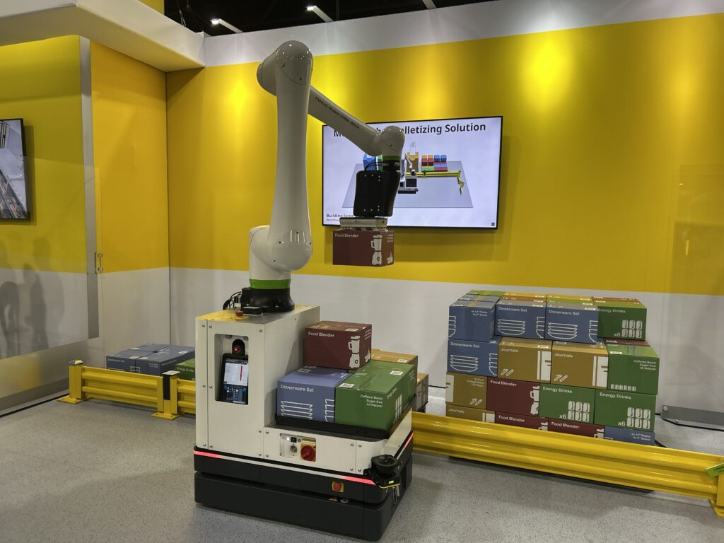 Fanuc America demonstrated cobot-enabled mobile robot palletizing at Modex 2026 in Atlanta, Georgia, showing automated handling of mixed products, including dinnerware and blenders.
