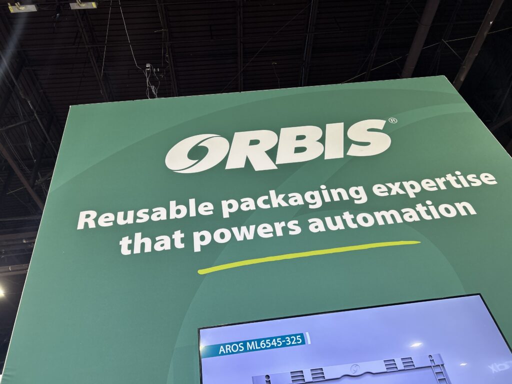 A view looking up at the ORBIS logo above the booth at Modex 2026 in Atlanta, Georgia.