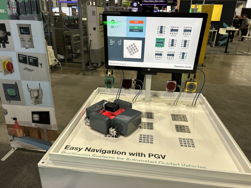 Pepperl+Fuchs PGV positioning system for automated guided vehicles on display at Modex 2026 in Atlanta, Georgia, demonstrating vision-based navigation using floor markers to guide vehicle movement.