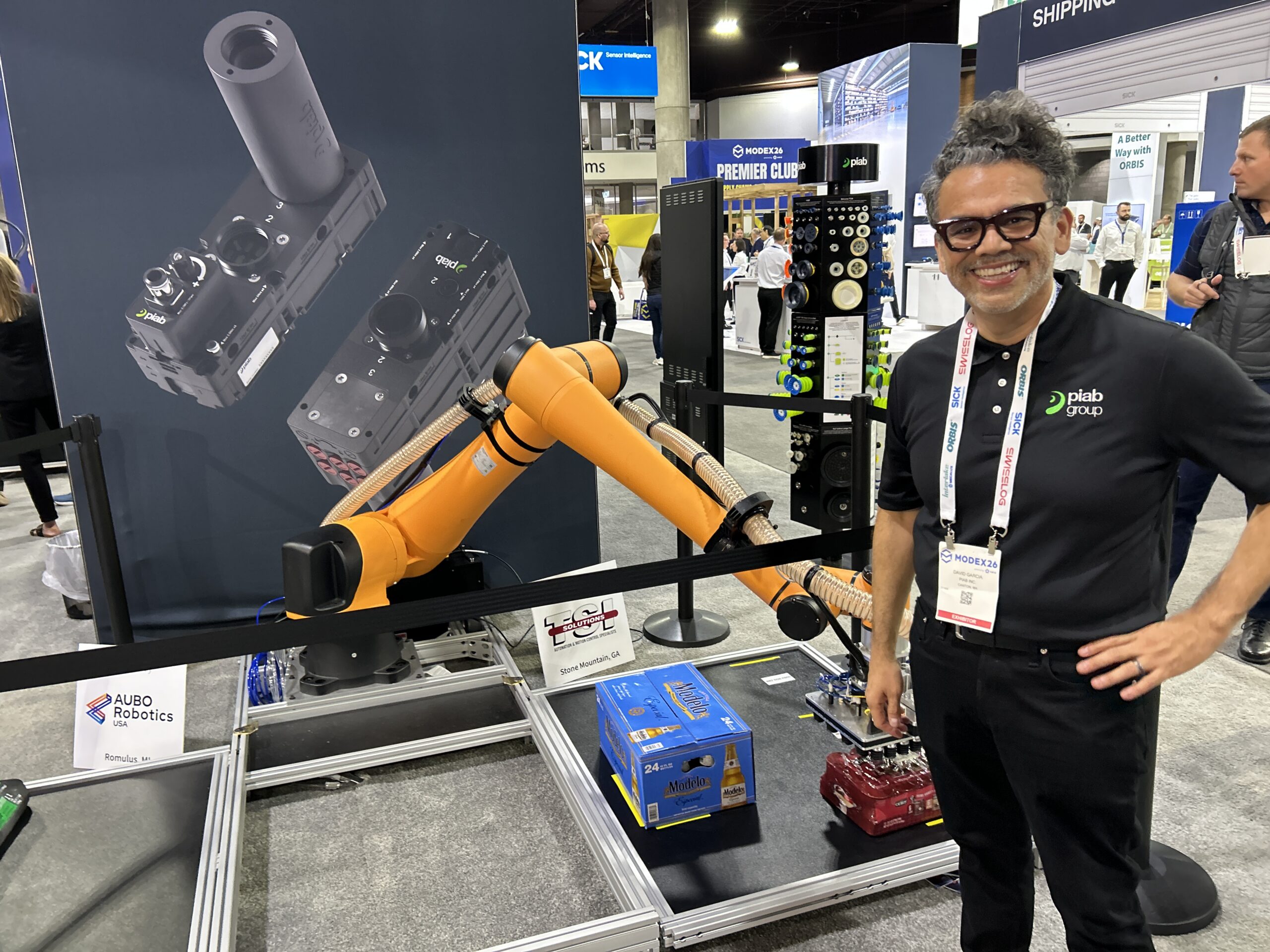David Garcia, area sales manager west for vacuum automation and robotic gripping division at Piab Group, at Modex 2026 in Atlanta, Georgia, standing next to the BLFF vacuum suction cup demo with an AUBO Robotics USA system.