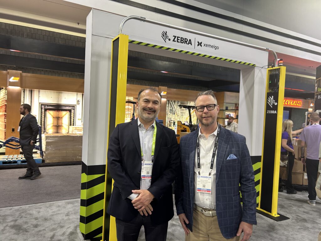 Andres Boullosa, global director of warehouse vertical strategy at Zebra Technologies (left side of image), and Wes Coleman, industry principal - warehousing at Zebra Technologies (right side of image), at Modex 2026 in Atlanta, Georgia, at the company’s booth.
