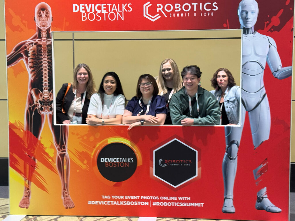 Attendees pose with WTWH Media editors from left to right: Stephanie Neil, VP editorial director; Sarah Wynn, senior editor for Packaging OEM; and Sheri Kasprzak, executive editor for Plant Engineering and Control Engineering, at the Robotics Summit & Expo in Boston.