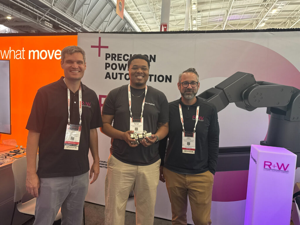 The R+W America team poses at their booth at the Robotics Summit & Expo in Boston, from left to right: Jake Larson, regional sales manager; Maurice Collins, marketing manager; and Andy Lechner, vice president of sales and marketing. The company showcased a variety of couplings for industrial applications.