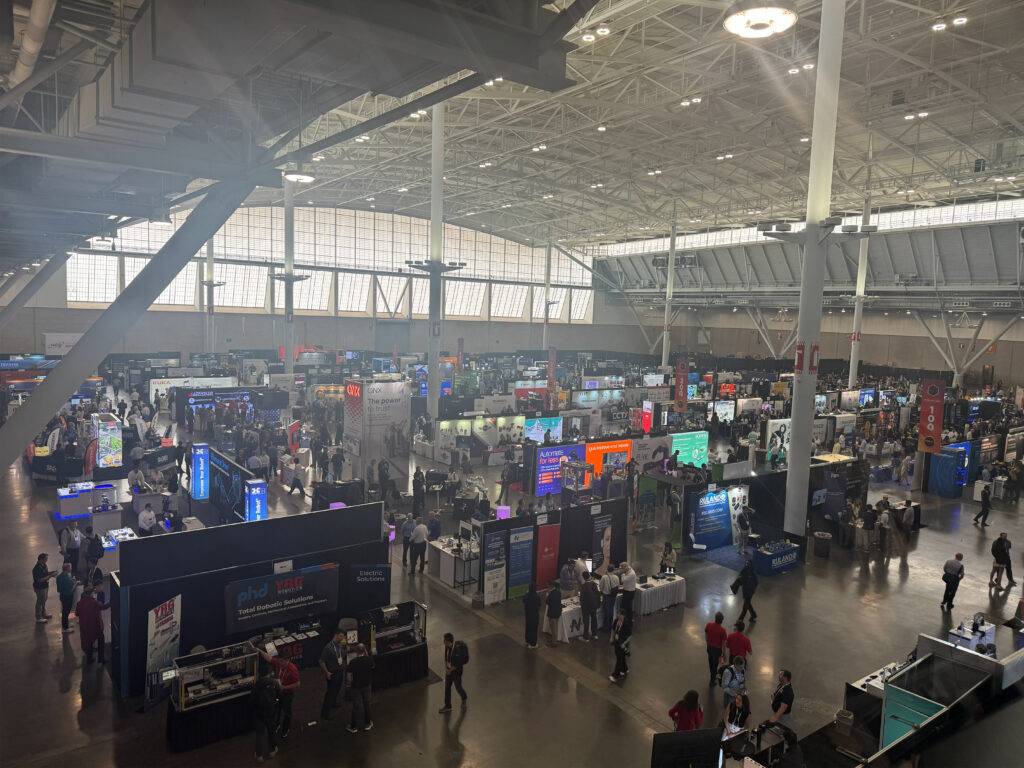 A wide view of the show floor at the 2026 Robotics Summit & Expo in Boston captured the scale of exhibits and demonstrations across robotics and automation technologies.