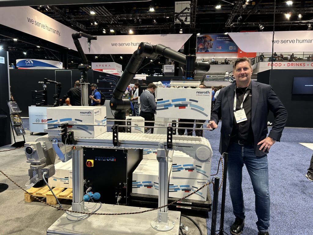 At Automate 2026, Kristian Kassow stands next to a Kassow Robots cobot, showcasing the company’s 7-axis design built for improved reach and flexibility in confined and mobile applications. 