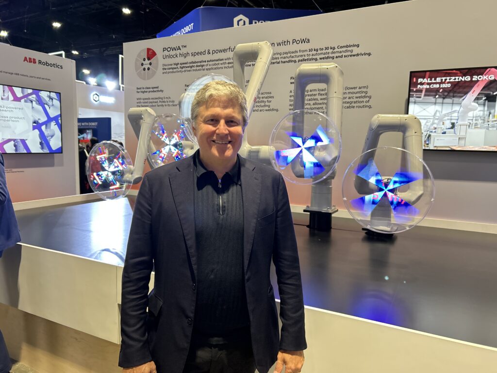 At Automate 2026, Craig McDonnell, managing director of business line industries at ABB, stands in front of the POWA palletizing demo, highlighting the company’s automation capabilities in end-of-line handling applications. 