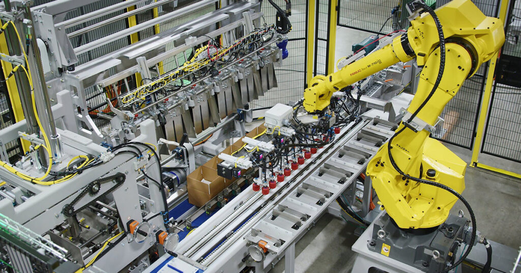 Automated robotic assembly line featuring a FANUC industrial robot integrated with Rockwell Automation controls. Source: Rockwell Automation