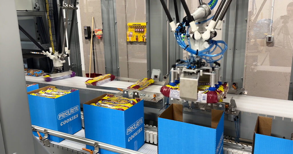 Quest’s Flexible One packaging system, which brings together technologies from multiple ProMach brands, uses robotic case packing technology to handle cookie boxes.