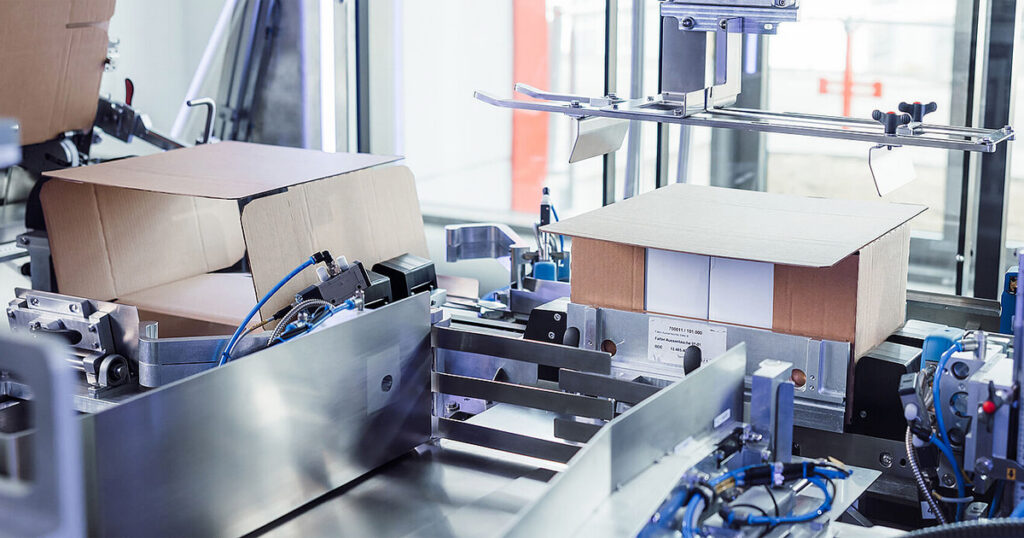 The SOMIC 202 cartoner collects, groups, and packs pre-packaged products into single-piece corrugated cartons.