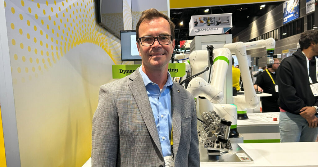Wes Garrett, FANUC’s executive director of global accounts for food and beverage, discusses AI and real-time vision technology during a robotic application using Inbolt’s physical AI technology to track a moving part.