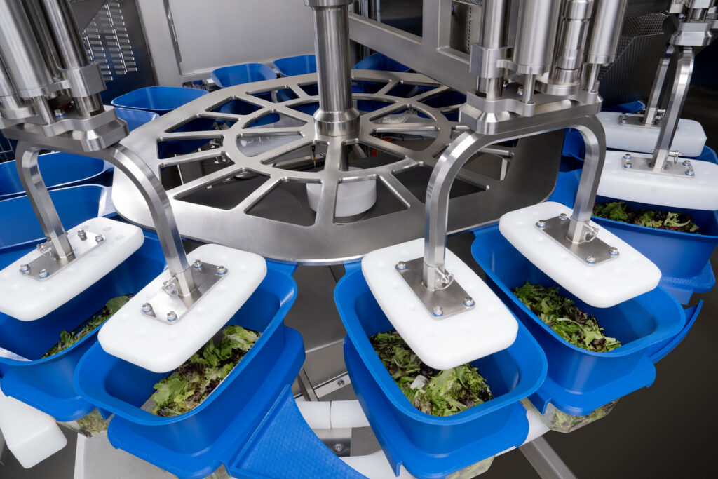 Spee-Dee’s rotary tray filler combines product filling and servo-controlled tamping for leafy greens and loose-fill products.