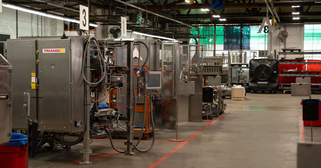 Packaging machines are assembled in designated work bays at Triangle Package Machinery’s Chicago facility, where the OEM manufactures vertical form-fill-seal baggers, multihead weighers, cartoners, and other packaging equipment.