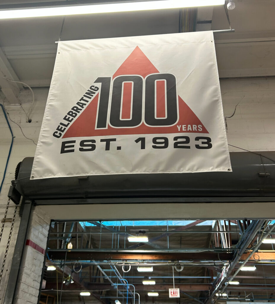 Triangle Package Machinery’s 100th anniversary sign